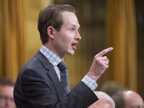 Conservative MP Michael Cooper rises during Question Period on Thursday, October 6, 2016 on Parliament Hill in Ottawa.