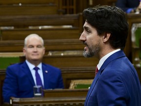 Prime Minister Justin Trudeau answers a question as Conservative leader Erin O’Toole looks on during question period in the House of Commons on Parliament Hill in Ottawa on Wednesday, Oct. 21, 2020.