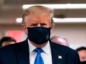 US President Donald Trump wears a mask as he visits Walter Reed National Military Medical Center in Bethesda, Maryland' on July 11, 2020. (Photo by ALEX EDELMAN / AFP) (Photo by ALEX EDELMAN/AFP via Getty Images)