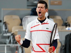 Novak Djokovic of Serbia celebrates after winning match point during his Men's Singles quarter-finals match against Pablo Carreno Busta of Spain on day eleven of the 2020 French Open at Roland Garros on Oct 7, 2020 in Paris, France.