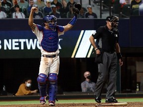 Austin Barnes of the Los Angeles Dodgers reacts after Cody Bellinger makes the out against Fernando Tatis Jr. of the San Diego Padres in the seventh inning of Game 2 of the National League Division Series at Globe Life Field on on Oct. 7, 2020 in Arlington, Texas.