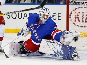 New York Rangers goaltender Henrik Lundqvist makes a glove save against the Carolina Hurricanes during the first period at Madison Square Garden in New York, Nov. 27, 2019.