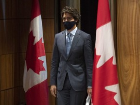 Prime Minister Justin Trudeau arrives for a news conference in Ottawa, Tuesday, Oct. 20, 2020. Trudeau is urging Canadians to adhere to local health guidelines when considering how to celebrate Halloween next week, acknowledging that not trick-or-treating will be hard on many kids.