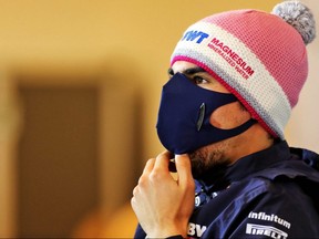 This handout photo released and taken Oct. 8, 2020 by the International Automobile Federation (FIA) shows Racing Point's Canadian driver Lance Stroll during the drivers' press conference for the Formula One Eifel Grand Prix at the Nuerburgring circuit in Nuerburg, Germany.