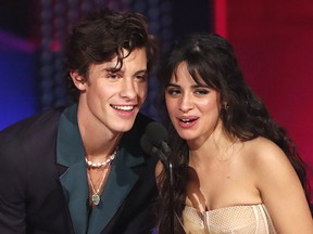 Shawn Mendes and Camila Cabello accept the Collaboration of the Year award for "Senorita" at the 2019 American Music Awards in Los Angeles.