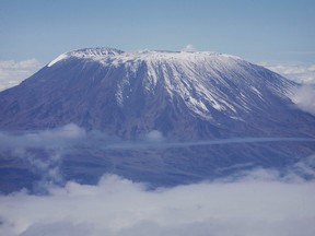 A fresh dusting of snow sits atop the dormant volcano of Mount Kilimanjaro, Africa's highest peak, in northern Tanzania, November 22, 2007.