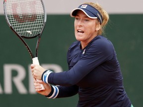 Madison Brengle plays a forehand during her first round match against Jelena Ostapenko on Day 3 of the 2020 French Open at Roland Garros in Paris, Sept. 29, 2020.