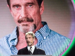 In this file photo taken on August 16, 2016 John McAfee, founder of the eponymous anti-virus company, speaks during the China Internet Security Conference in Beijing.