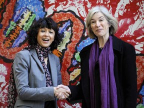 French microbiologist Emmanuelle Charpentier, left, and professor Jennifer Doudna of the U.S. pose for the media during a visit to a painting exhibition by children about the genome, at the San Francisco park in Oviedo, Spain, Oct. 21, 2015.