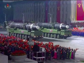 A screen grab taken from a KCNA broadcast on Saturday, Oct. 10, 2020 shows North Korean Hwasong-12 intercontinental ballistic missiles during a military parade marking the 75th anniversary of the founding of the Workers' Party of Korea, on Kim Il Sung square in Pyongyang.