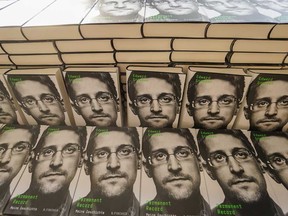 Copies of the book titled "Permanent Record" by U.S. former CIA employee and whistleblower Edward Snowden are for sale on the sidelines of a video conference in that he spoke about the book on Sept. 17, 2019 in Berlin.
