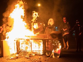 Protesters set a sofa on fire in West Philadelphia on October 27, 2020, during a demonstration against the fatal shooting of 27-year-old Walter Wallace, a Black man, by police.