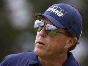 Phil Mickelson watches the fairway after hitting his tee shot on the 17th hole during the final round of the Charles Schwab Series at Ozarks National, in Branson, Mo., Aug. 26, 2020.