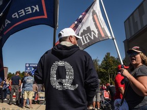 A person wears a QAnon sweatshirt during a pro-Trump rally on Oct. 3, 2020 in the borough of Staten Island in New York City.