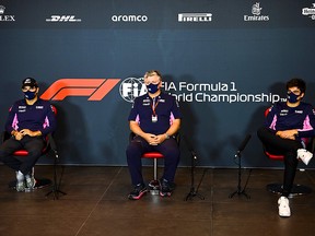 Racing Point's Sergio Perez (left), CEO and Team Principal Otmar Szafnauer (middle)and Lance Stroll attend a press conference at the Autodromo Internazionale Enzo e Dino Ferrari race track in Imola, Italy, on October 30, 2020.
