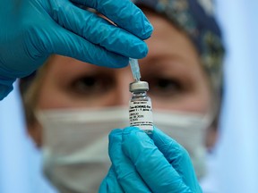 A nurse prepares Russia's "Sputnik-V" vaccine at a clinic in Moscow September 17, 2020.