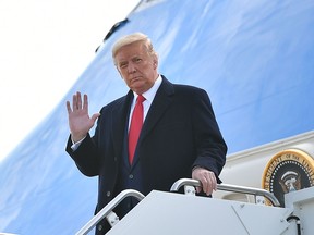 President Donald Trump steps off Air Force One upon arrival at Bangor International Airport in Bangor, Maine on October 25, 2020.