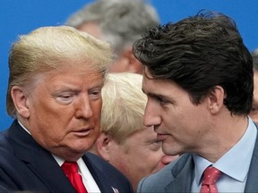 U.S. President Donald Trump talks with Prime Minister Justin Trudeau during a North Atlantic Treaty Organization Plenary Session at the NATO summit in Watford, England, Dec. 4, 2019.