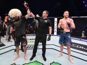 Khabib Nurmagomedov celebrates his victory over Justin Gaethje in their lightweight title bout during UFC 254 on October 25, 2020 on UFC Fight Island. (Josh Hedges/Zuffa LLC via Getty Images)