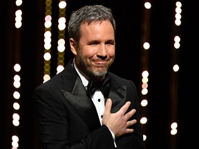 Canadian director Denis Villeneuve gestures as he arrives on stage on May 8, 2018 during the opening ceremony of the Cannes Film Festival.
