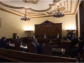 Vatican Court President Giuseppe Pignatone speaks during a hearing of the trial of two Italian priests, one charged with raping an altar boy in a youth seminary and the other of abetting and cover up, in this still image taken from video, at the Vatican, October 14, 2020.