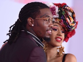 In this file photo taken on October 9, 2018 US rapper Cardi B and US rapper Offset arrive at the 2018 American Music Awards in Los Angeles, California.