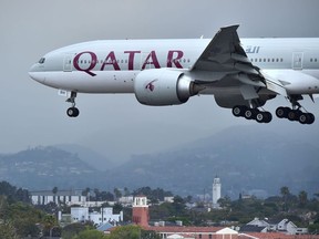 This file photo taken on March 21, 2017 shows a Qatar Airways aircraft coming in for a landing at Los Angeles International Airport.