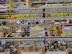 Amazon workers perform their jobs inside an Amazon fulfillment centre on Cyber Monday in Robbinsville, N.J., Dec. 2, 2019.
