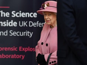Britain's Queen Elizabeth visits the Energetics Analysis Centre at the Defence Science and Technology Laboratory at Porton Science Park near Salisbury, Britain October 15, 2020.