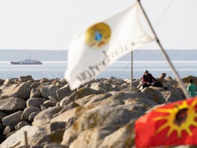 A Canadian Coastguard patrols the South Western parts of Nova Scotia as non-native commercial fishermen protest against a Mi'kmaq lobster fishery, in Saulnierville, Nova Scotia, Canada October 19, 2020.