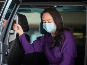 Meng Wanzhou, chief financial officer of Huawei, wears a face mask to curb the spread of COVID-19 as she arrives at B.C. Supreme Court to attend a hearing in Vancouver, on Tuesday, September 29, 2020.