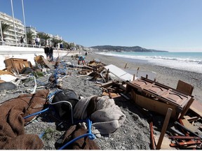 People are seen on a private beach following heavy rainfall in Nice, France October 3, 2020.