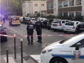 Police officers guard a scene where an Orthodox priest was shot and injured as the assailant fled, as police source claims, in Lyon, France October 31, 2020 in this screen grab obtained from a social media video.