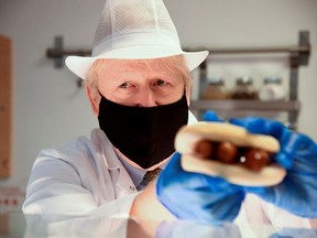 Britain's Prime Minister Boris Johnson visits the Royal Berkshire Hospital in Reading, Britain October 26, 2020.