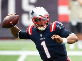 New England Patriots quarterback Cam Newton looks to pass against the Las Vegas Raiders during the fourth quarter at Gillette Stadium.