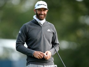 Dustin Johnson smiles on the eleventh green during a practice round for the 2020 U.S. Open golf tournament at Winged Foot Golf Club - West.
