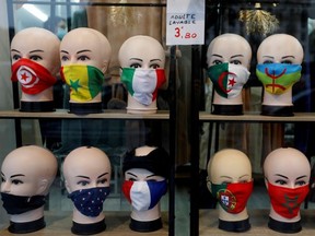 Protective face masks with flags design are seen on display in a shop in Paris, as the coronavirus disease (COVID-19) outbreak continues in France, October 13, 2020.