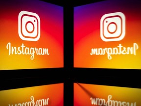 The Instagram logo is displayed on a smartphone in Toulouse, France, Sept. 29, 2020.