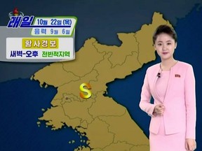 A weather caster of North Korea's state-run television KRT appears on screen in Pyongyang, North Korea, Oct. 21, 2020, in this still image taken from video.
