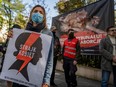 Pro-choice activists from "Women Strike" (Strajk Kobiet) attends a protest in front of Poland's constitutional court ahead of an abortion ruling, in Warsaw, Thursday, Oct. 22, 2020.