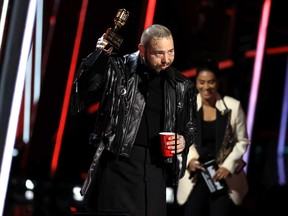 Post Malone accepts the Top Male Artist award onstage for the 2020 Billboard Music Awards broadcast on Oct. 14, 2020 at the Dolby Theatre in Los Angeles, Calif.
