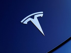 The front hood logo on a 2018 Tesla Model 3 electric vehicle is shown in this photo illustration taken in Cardiff, California, U.S., June 1, 2018.