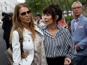 Catherine Oxenberg and Toni Natalie embrace after the guilty verdicts in the sex trafficking and racketeering case against Nxivm cult founder Keith Raniere outside the Brooklyn Federal Courthouse in New York, U.S., June 19, 2019.