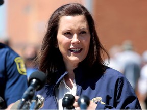 Michigan Governor Gretchen Whitmer addresses the media about the flooding along the Tittabawassee River, after several dams breached, in downtown Midland, Michigan, U.S., May 20, 2020.