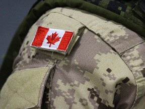 A Canadian flag sits on a members of Canadian forces that are leaving from CFB Trenton, in Trenton, Ont., on October 16, 2014.