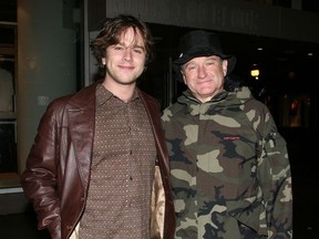 Robin Williams (right) and son, Zachary, pose for a shot after having dinner at Vaticano, one of Toronto's hot celebrity restaurants.