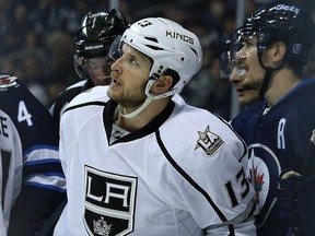 Los Angeles Kings forward Kyle Clifford looks up at the scoreboard after being penalized for boarding Winnipeg Jets forward Kyle Connor during NHL action in Winnipeg on Sun., Nov. 13, 2016.