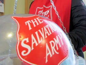 A Salvation Army volunteer accepts donations last December in this file photo.