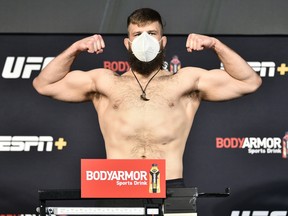 In this handout image provided by UFC, Tanner Boser poses on the scale during the UFC weigh-in at UFC APEX on June 26, 2020, in Las Vegas.