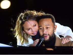 Singer John Legend is joined onstage by his wife, Chrissy Teigen, while performing before Democratic vice presidential nominee Sen. Kamala Harris (D-CA) speaks at a drive-in election eve rally on November 2, 2020 in Philadelphia, Pennsylvania.